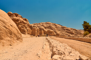Fototapeta premium Petra, the legendary city carved into the rock in Jordan in 2024 with tourist 