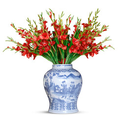 A bouquet of red gladioli in a blue-and-white vintage porcelain vase adorned with a Chinese landscape design, set against a white background.