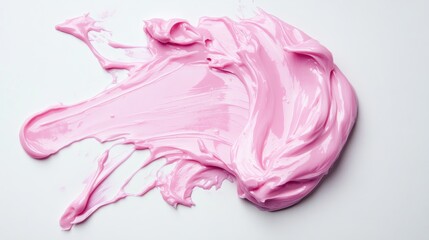 Smooth pink cosmetic cream smear artistically spread across a pristine white background, showcasing its creamy texture and vibrant color.