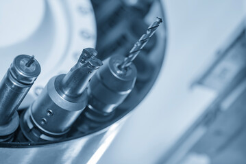 The indexable tool in the tool magazine of machining center in the light blue scene. © Pixel_B
