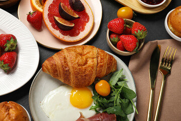 Different tasty food served for brunch on grey textured table, flat lay