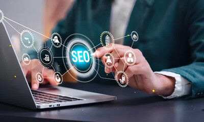 IT employee working on computer, close-up. Businessman in front of laptop for SEO search engine optimization analysis. Concept: website traffic ranking and search engines.