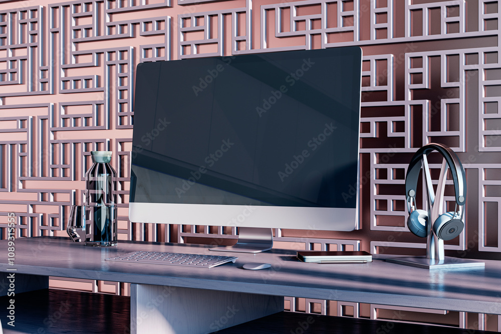 Fototapete Creative designer workplace with decorative ornamental wall, various small objects and big computer monitor with mock up place. 3D Rendering.
