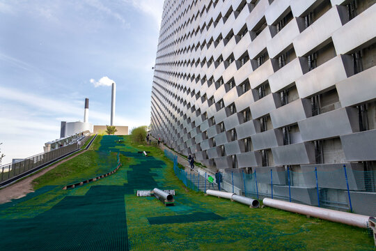 People in public space on the roof of Amager Bakke known as Amager Slope or Copenhill, power waste to energy plant with recreational facility in Copenhagen, Denmark