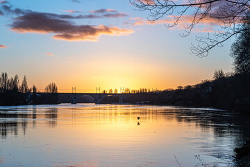 Naklejka premium sunset over the river