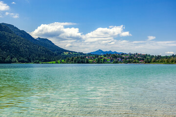 Obraz premium german village -Hopfen am See- Hopfen lake in summer with mountain background. Bavarian town , Füssen, Swabian,Ostallgäu. Air and Kneipp spa resort
