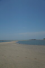 Exploring the calm shoreline at a tranquil beach coastal retreat natural landscape panoramic view serenity of nature
