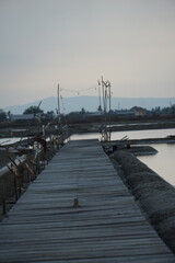 Obraz premium Serene dock at dusk tranquil waterfront photography natural landscape side view peaceful reflection