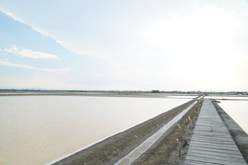 Salt harvesting process coastal salt flats photography natural landscape aerial view sustainable practices