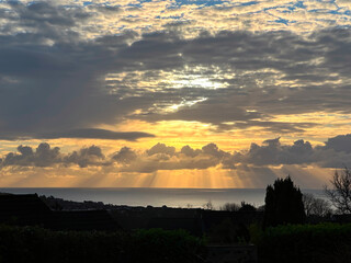 The Sun's rays at sunrise create a dramatic sky over the Irish Sea and taken from Onchan on the Isle of Man
