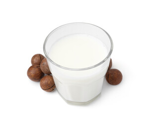 Glass of macadamia milk and nuts isolated on white