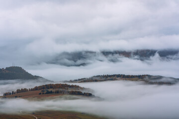 Morning mist over Seiser Alm in the Dolomites, Italy.