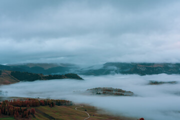 Morning mist over Seiser Alm in the Dolomites, Italy.
