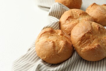 Homemade tasty buns on light table, closeup. Space for text