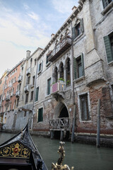 Obraz premium Gondola ride with the view of canal in venice, italy.