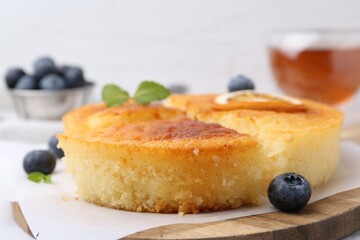 Tasty semolina cake served on table, closeup