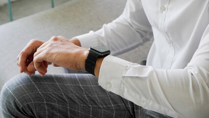 close up of man's hand wearing smart watch, nervous mood