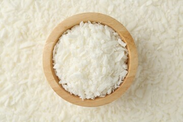 White soy wax flakes and bowl, top view