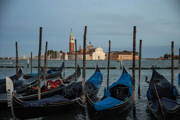 Night view of gondolas, canals and old town background Italy, Venice.