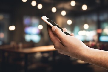 Hand typing on phone for social media