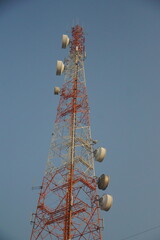 Telecommunication tower construction urban setting infrastructure development clear sky engineering perspective connectivity expansion