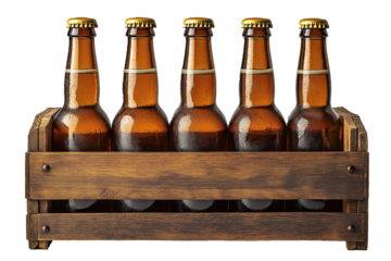 Beer bottles in an old wooden box on white background