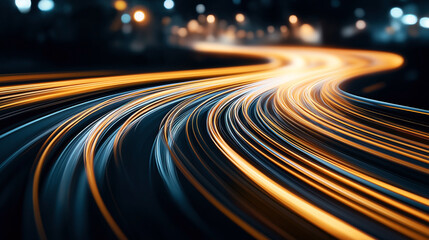 Abstract image of light trails on a curved road at night with bokeh effect. Featuring vibrant orange and blue streaks representing vehicle movement in an urban setting.