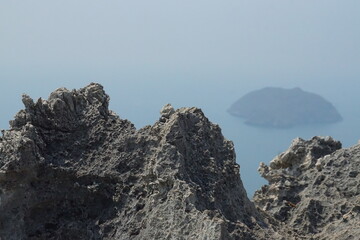 Scenic rocky landscape overlooking a misty island coastal viewpoint natural beauty serene environment photography concept for calm vibes