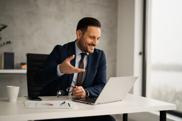 Successful businessman have video conference call at office