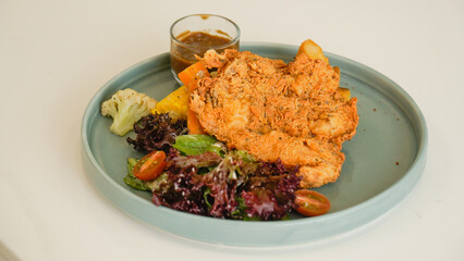 Crispy Chicken Steak, Mix Salad Sauted Mixed Vegetable, Choices of Potatos and Sauce