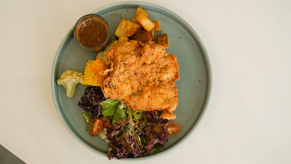 Crispy Chicken Steak, Mix Salad Sauted Mixed Vegetable, Choices of Potatos and Sauce