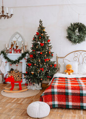 Cozy Christmas decoration in a warm bedroom with a festive tree and toys