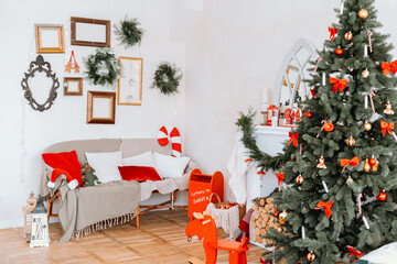 Cozy holiday living room decorated with a Christmas tree and festive elements