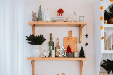 Decorative wooden shelves with winter accessories in a cozy indoor space