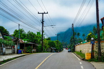 Rural road journey through lush greenery scenic village photography tranquil environment landscape...