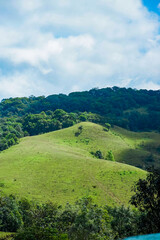 Obraz premium Scenic green hills countryside nature photography lush landscape wide angle view serenity in nature