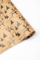 Christmas wrapping paper roll for gifts with drawing of the moose on a white background. Top view, close up