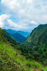 Majestic mountain landscape lush green valleys nature photography serene environment wide-angle view scenic beauty