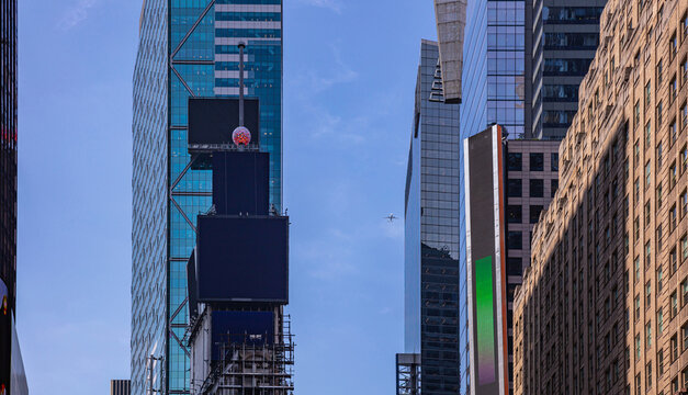 New York, Times Square. Manhattan. Crystal ball and black blank billboards. High buildings view from below