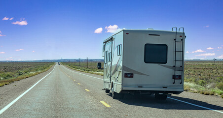 RV recreational vehicle on the highway, rear view. United States of America countryside