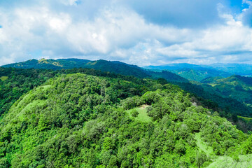 Obraz premium Exploring lush green landscapes mountain range aerial photography natural environment scenic view outdoor adventure