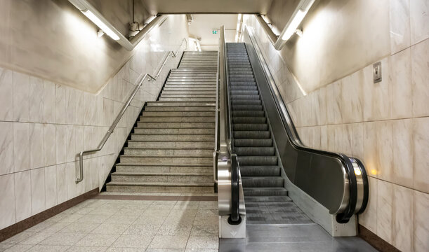 Underground empty electric escalators and stairway in the city center.