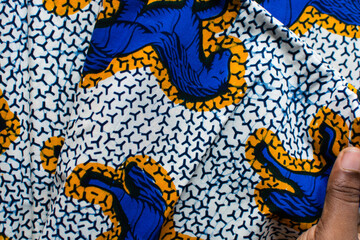 top view of blue ankara fabric, flatlay of nigerian wax cloth with designs, spread out blue ankara material