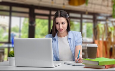 Stylish woman freelancer work on laptop in cafe