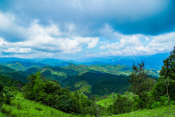 Naklejka premium Breathtaking mountain view lush green hills natural landscape serene environment wide angle tranquility in nature