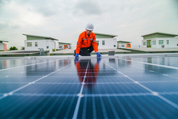 engineer man inspects construction of solar cell panel or photovoltaic cell by electronic device....