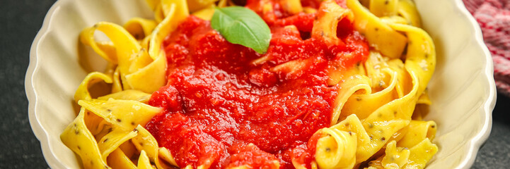 Pasta tagliatelle tomato sauce tasty food dish fresh gourmet food background on the table rustic food top view copy space