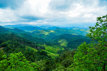 Fototapeta premium Breathtaking mountain view lush green hills nature landscape serenity wide angle tranquility and exploration