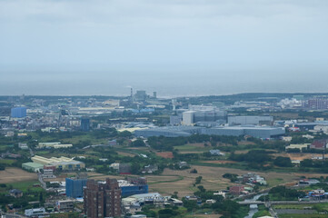 Naklejka premium Looking from airplane of the Taipei city view, Taiwan. Ariel view of Taipei cityscape. Stunning nature and cityscape. Travel concept.