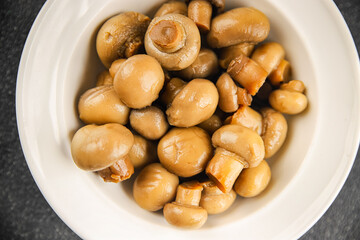 Champignon mushroom canned product tasty food dish fresh delicious gourmet food background on the table rustic food top view copy space top view keto and paleo diet Vegetarian and vegan food